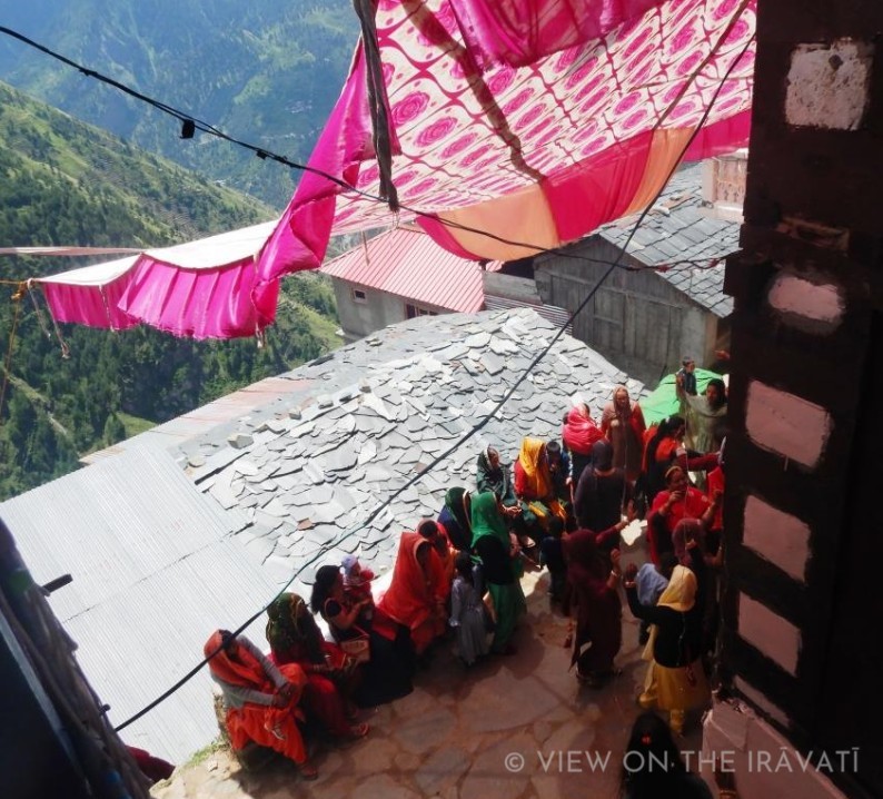 Tent and corner of kath kuni Gaddi home during wedding.
