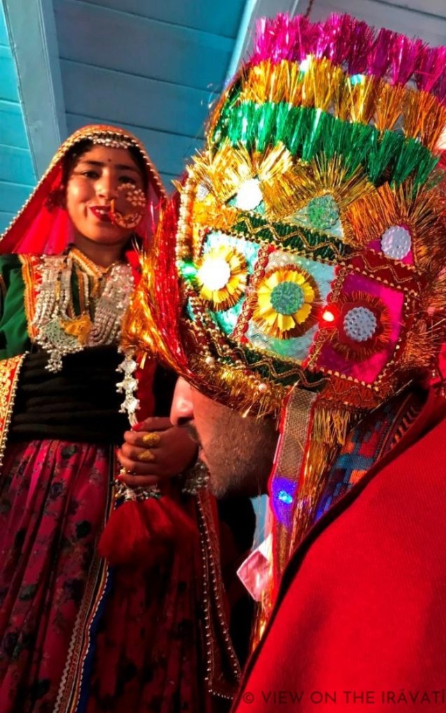 Side view of groom's sera with smiling bhabhi in background.