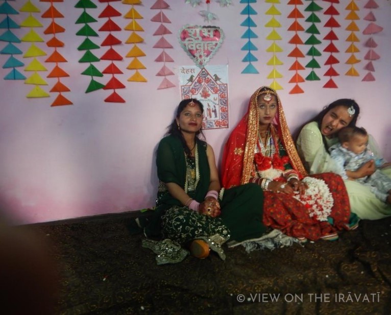 Gaddi bride taking picture with wedding guests 