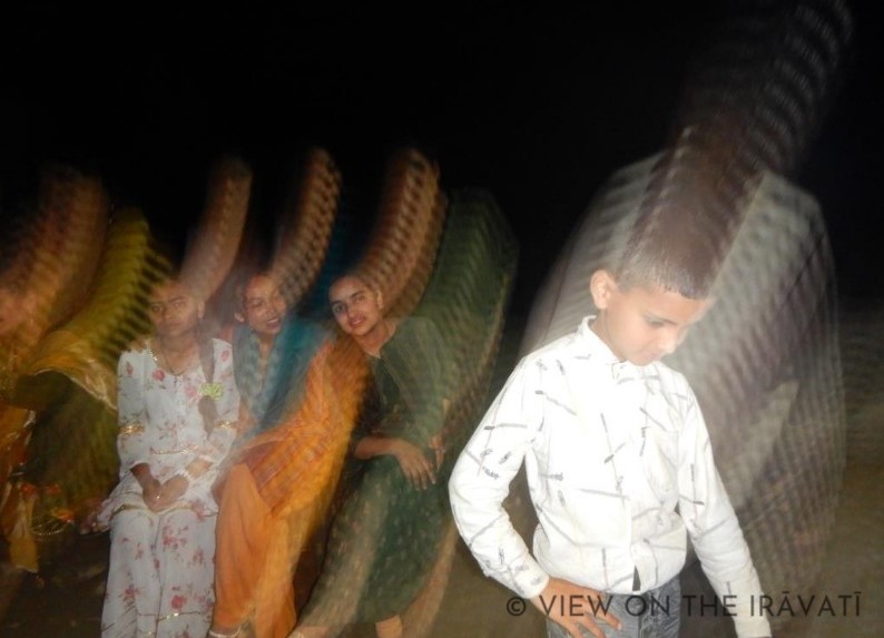 blurred picture of kids at a Gaddi marriage