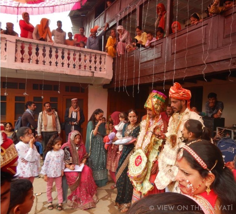 Gaddi wedding party giving gifts to groom before baraat