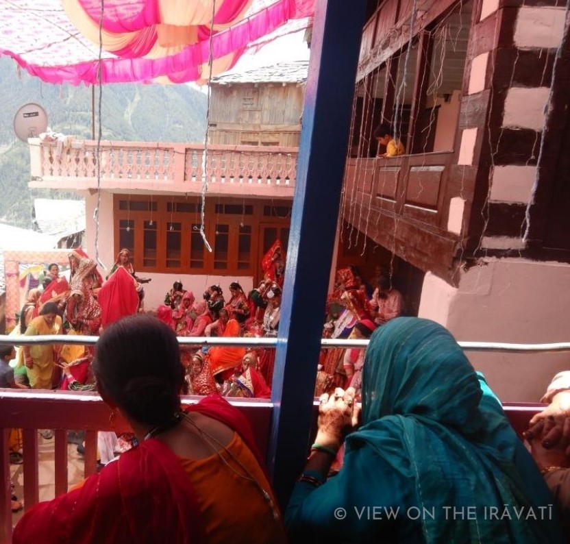 Gaddi women watching Padhua from a veranda.
