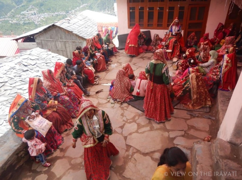 Women wearing luanchari participating in Padhua ceremony during Gaddi marriage.