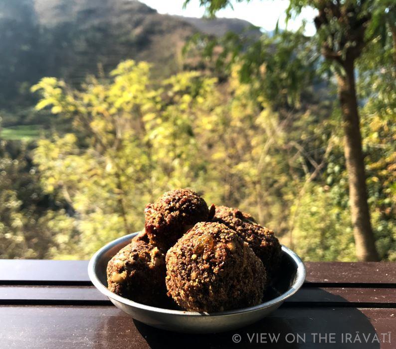 Alsi Laddus on window sill with view of Himachal hills in background