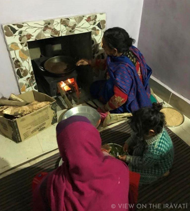 sitting by chula in Gaddi household